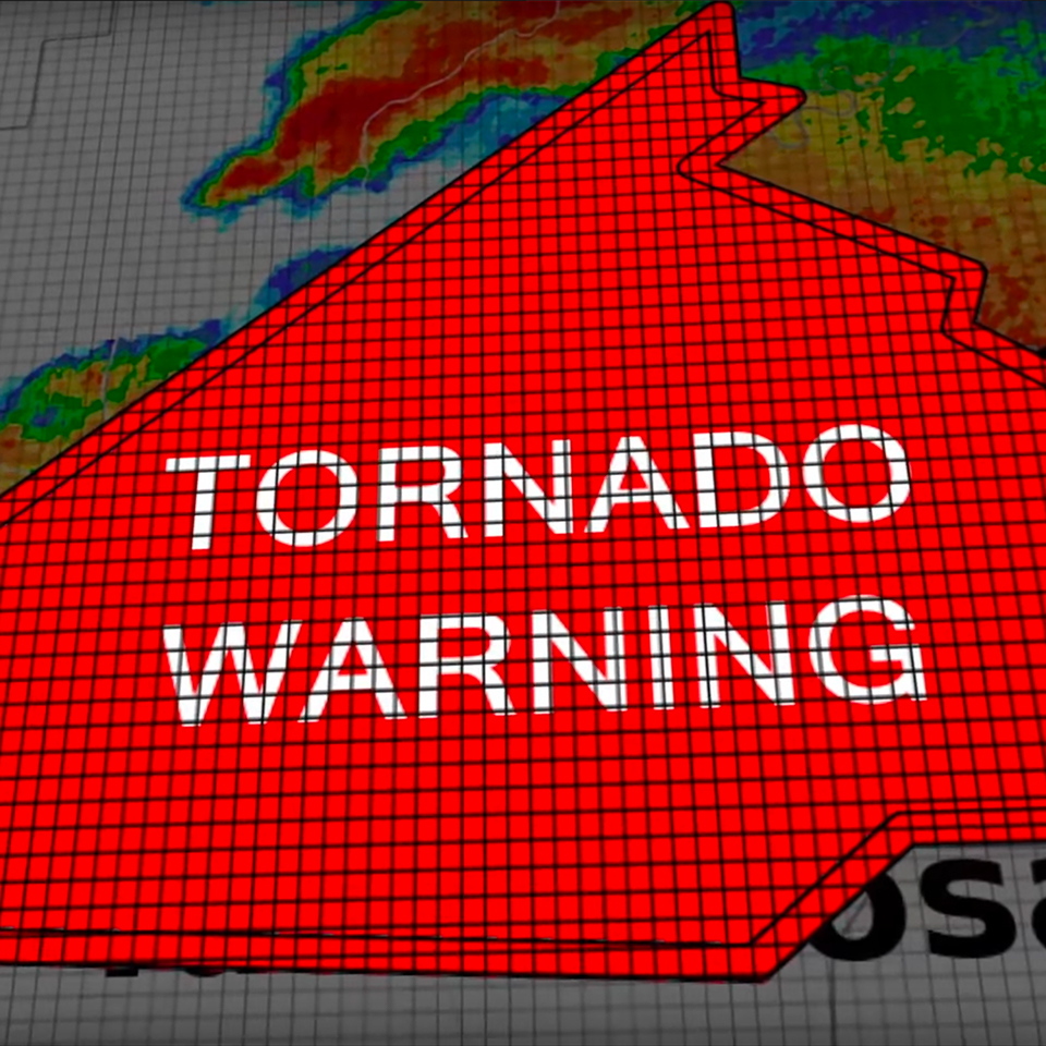 radar display with red polygon overlay with text that says 'tornado warning'